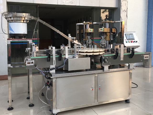 capping machine with 2 capping heads poluautomatska oprema za zatvaranje vijaka.jpg