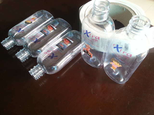 transparent labels labelled samples bottles plane surface Mrwan uzorak prozirnih etiketa i boca (3).jpg